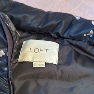 Floral vest from the loft has pockets. It’s like new.
